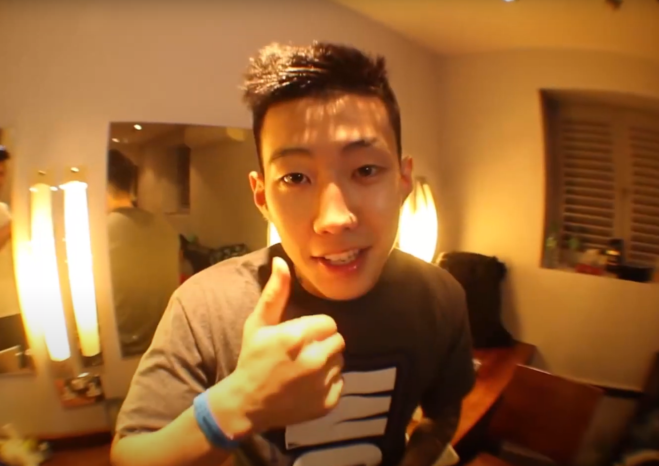 jay park yellow hue with thumbs up in bedroom